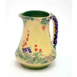 A Burleigh ware Rock Pattern jug, relief moulded and decorated with country flowers against a pri...