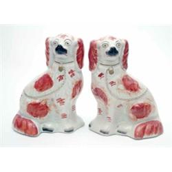 A pair of 19th century Staffordshire liver and white spaniels, (one cracked) 10.5ins...