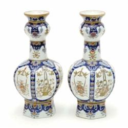 A pair of porcelain vases, possibly French, of double baluster form decorated with panels of flor...