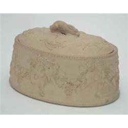 A Wedgwood earthenware game pie dish, and liner, the cover relief moulded with hare knop and game...