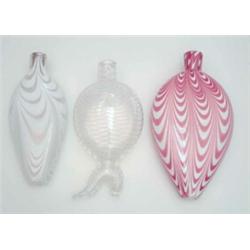 A late Victorian Nailsea-type flask, in the form of a boot, 8ins and 2 other Nailsea-type ovoid f...