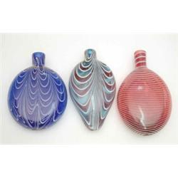 Three late Victorian Nailsea-type glass flasks, various colours and striped effects, largest 6.5i...