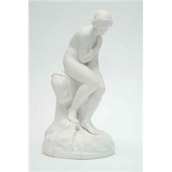A Victorian parian figure, of a semi-draped lady seated against a tree-stem, on circular base, (c...
