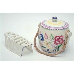A Poole biscuit barrel and cover, painted in polychrome, 6.25ins and a similar toast rack...