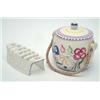 Image 1 : A Poole biscuit barrel and cover, painted in polychrome, 6.25ins and a similar toast rack...