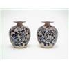 Image 1 : A pair of George Tinworth Doulton vases, with flared rims and narrow necks of globular form, each...