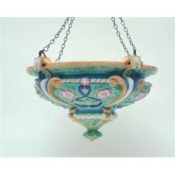 A Mintons majolica ceiling dome, relief moulded and brightly enamelled with flowers and leaves an...