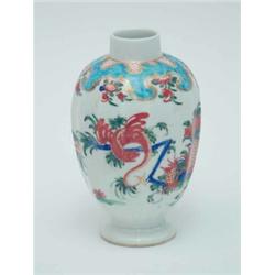 An 18th century Worcester tea caddy, of oval shape painted with sprouting foliage in bright ename...