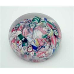 A mid-19th century French glass paperweight, scrambled canes in floral and spiral designs, 2.5ins...