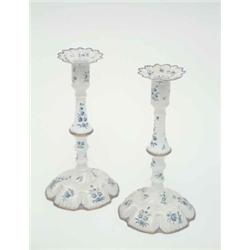 A pair of 18th century South Staffordshire enamel candlesticks, with detachable sconces, painted...