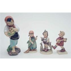 Three W.Goebel figures of children, 4.75ins overall and a further figure of an Eastern child carr...