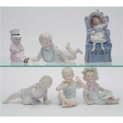 A collection of 6 piano babies, including a pair of crawling twins, a girl feeding a chick and tw...