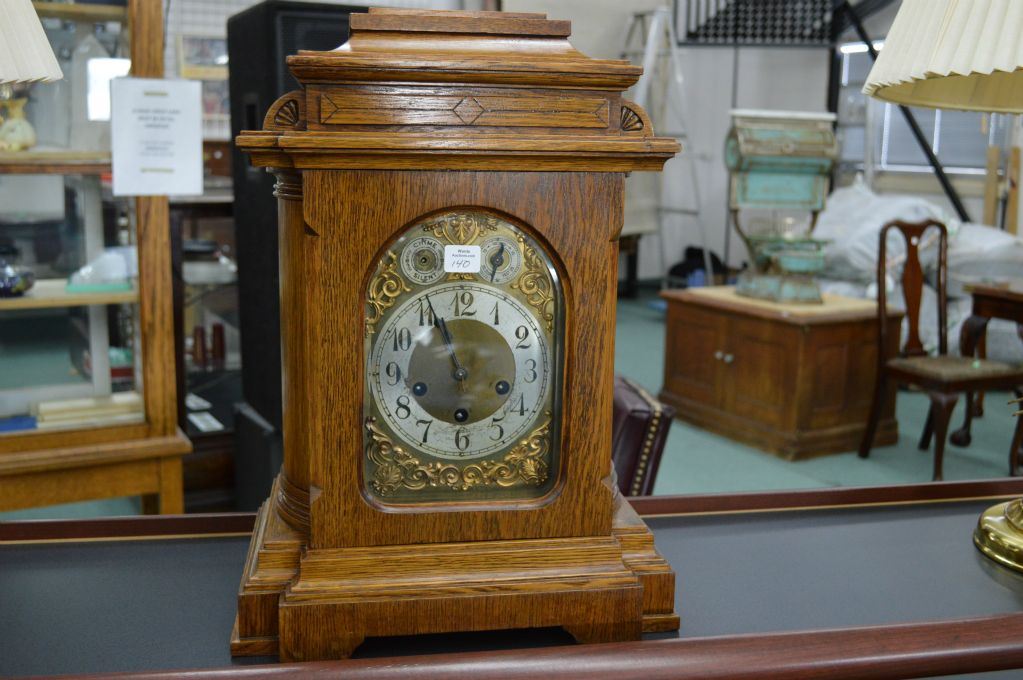 An oak cased antique chiming mantle clock made by Unghans J, German ...