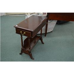 A single drawer end table with under book storage made by Kroehler