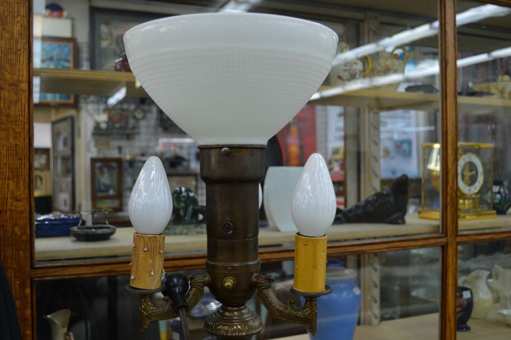 Antique floor torch style floor lamp with four candle style bulbs on a cast and marble base