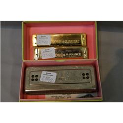 Two Echophone harmonicas by Hohner, one in the key of C, one in G and a boxed Glockenreine Stinnung 