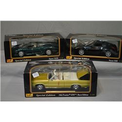 Three Maisto collectible die cast 1:18 scale cars including 1965 Pontiac GTO convertible -Hurst edit