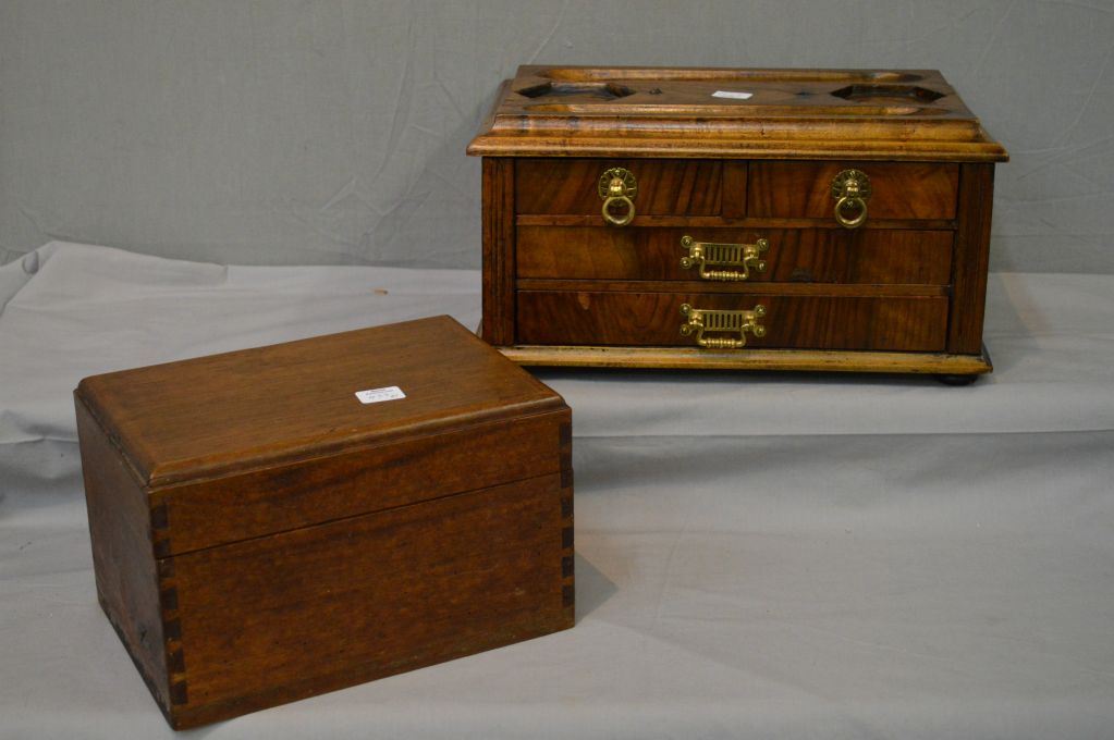 An antique wooden letter box with four drawers and fitted top and a