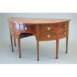 A late George III inlaid mahogany demi lune sideboard with central drawer flanked by an arrangeme...