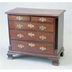 A George III mahogany chest of two short and three long graduated drawers fitted brass loop handl...