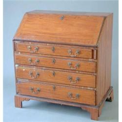 A George III satinwood and crossbanded bureau with slant enclosing fitted interior over four grad...