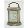 Image 1 : A late 19th century French oval brass carriage clock, with circular enamelled dial, movement stam...