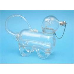 A novelty glass claret jug modelled as a bear, with silver mounted stopper....