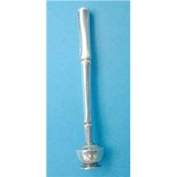 A Tiffany and Co Sterling pipe tamper, with bamboo effect handle....