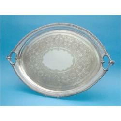 A Victorian plated tray, of elliptical form with beaded border, 30.5 ins....