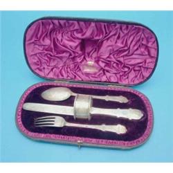 A Victorian silver knife, fork and spoon christening set, with associated napkin ring, in fitted...