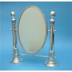 A plated dressing table mirror with oval plate, 20 ins....