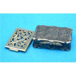 A Victorian engraved silver vinaigrette of serpentine rectangular form with scroll grille, Birmin...