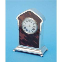 A George V silver and tortoiseshell 8-day timepiece with circular dial, Chester 1915. 5.5 ins....