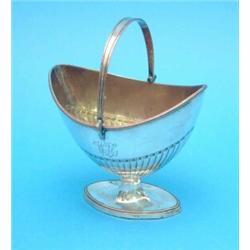 An Old Sheffield plate sugar basket of demi fluted elliptical form....