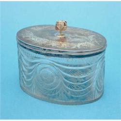 A George III silver mounted cut glass biscuit box of oval form with later finial and conflicting...