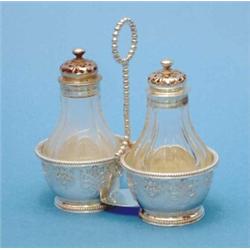 A Victorian silver two-bottle cruet stand fitted with a pair of cut glass casters, Makers Robert...