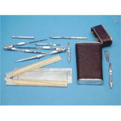 An 18th Century English drawing instrument set, circa 1740, with silver mounted black fishskin po...