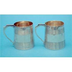 A pair of George III silver barrel mugs with reeded banding, 1793, (7oz.)...