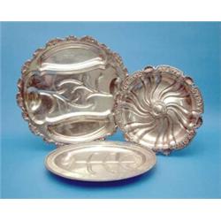 A Continental white metal serving dish with scroll and flower decoration, 14 ins, a plated meat p...