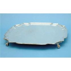A George VI silver salver of octagonal form with claw and ball feet, 14 ins, 1936, (46oz.)...