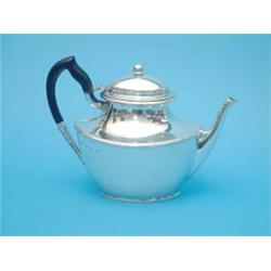 A Victorian silver teapot of oval form with ebonised handle, Birmingham 1898, (gross 25 oz.)...