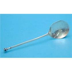A white metal apostle spoon and a similar seal top spoon....
