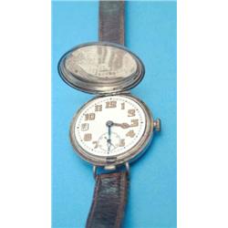 An early 20th century silver hunter wrist watch with arabic dial and subsidiary seconds....