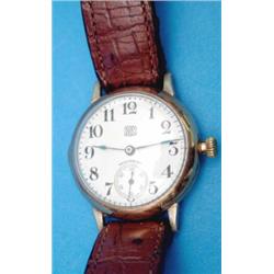 A gentlemans rolled gold Waltham Cross wrist watch with enamelled Arabic dial and subsidiary seco...