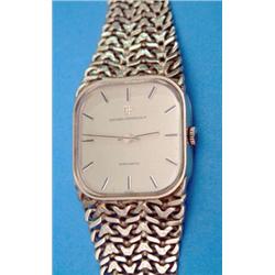 A gentlemans 18ct gold Girard-Perregaux Gyromatic watch with rounded gilt dial and textured flexi...