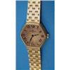 Image 1 : A ladys 18ct gold Baume and Mercier wrist watch with hexagonal dial and textured bracelet....