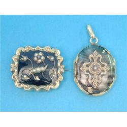 A Victorian gold and black enamel rectangular memorial brooch, with applied flowerhead decoration...
