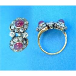 A gold diamond and cabochon ruby double cluster crossover ring...