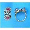 Image 1 : A gold diamond and cabochon ruby double cluster crossover ring...