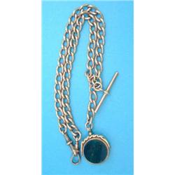 A 9ct gold curblink albert, with 15ct gold mounted hardstone swivel fob seal, gross weight 62.4gr...